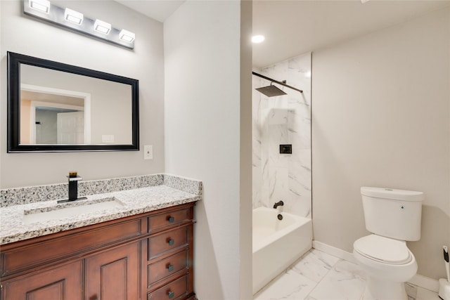 full bathroom with toilet, vanity, and tiled shower / bath