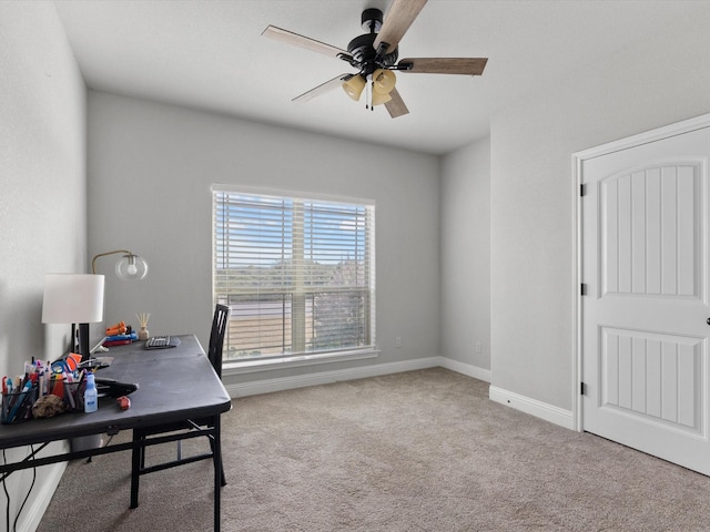 office featuring ceiling fan and light colored carpet