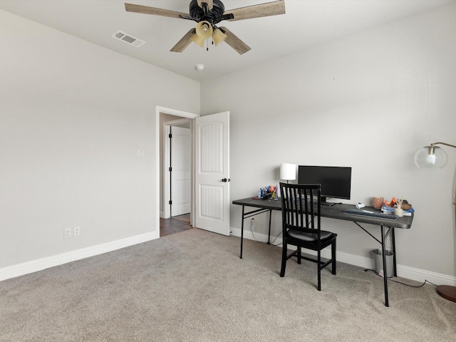 office space with ceiling fan and carpet