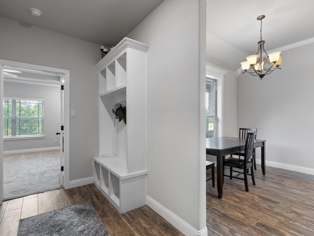 mudroom featuring a chandelier