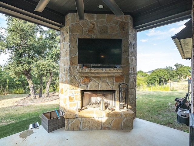 view of patio / terrace featuring an outdoor stone fireplace