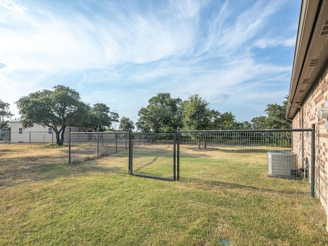 view of yard with central AC unit