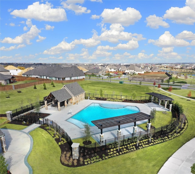 pool featuring a gazebo, a yard, fence, and a residential view