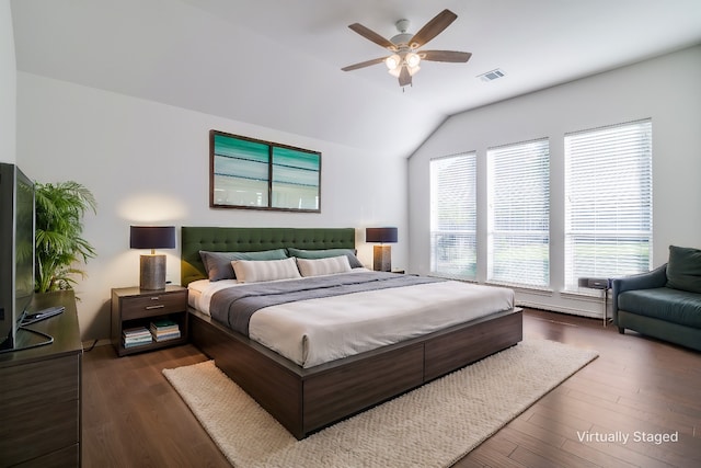 bedroom featuring ceiling fan, vaulted ceiling, and dark hardwood / wood-style floors