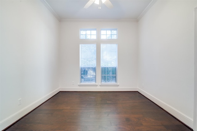 spare room featuring ceiling fan, dark wood-type flooring, and ornamental molding