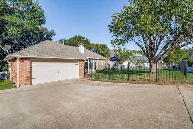 single story home with a garage and a front yard