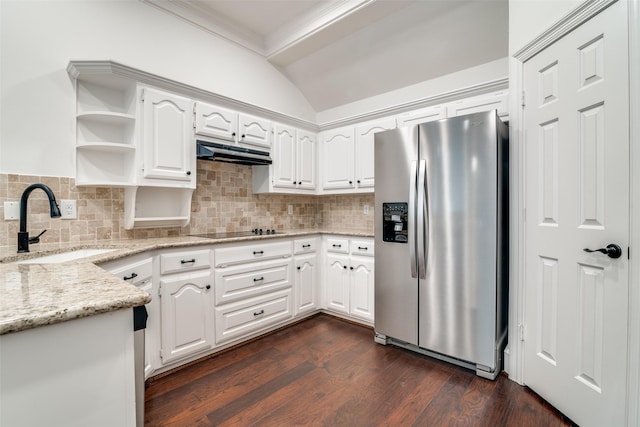 kitchen featuring stainless steel refrigerator with ice dispenser, light stone countertops, white cabinets, and sink