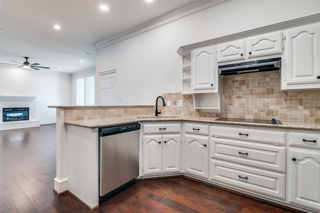 kitchen with black electric stovetop, sink, white cabinets, and dishwasher