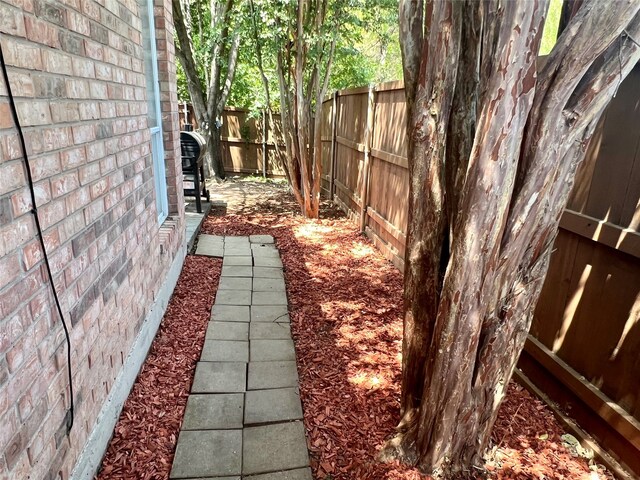 view of playground featuring a patio