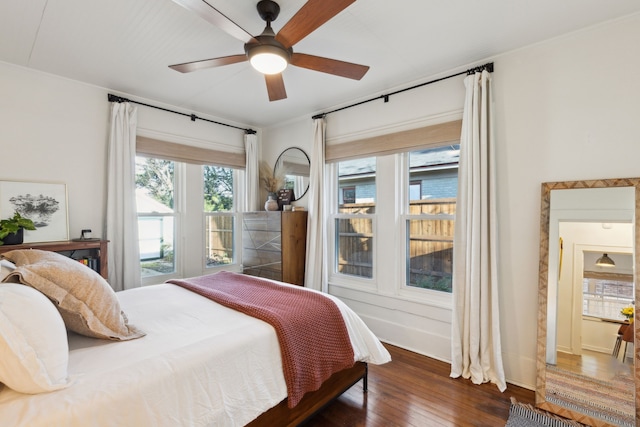 bedroom featuring ceiling fan and dark hardwood / wood-style floors