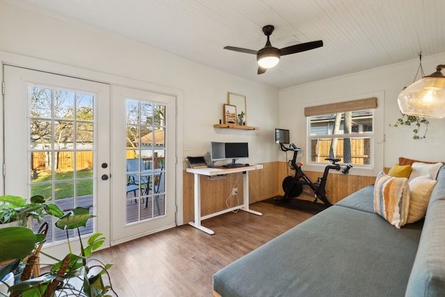 bedroom featuring ceiling fan, hardwood / wood-style floors, access to outside, and french doors