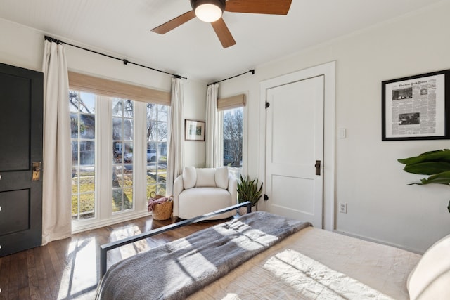 bedroom with ceiling fan and dark hardwood / wood-style flooring