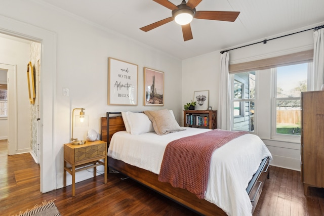 bedroom featuring ceiling fan and dark hardwood / wood-style floors