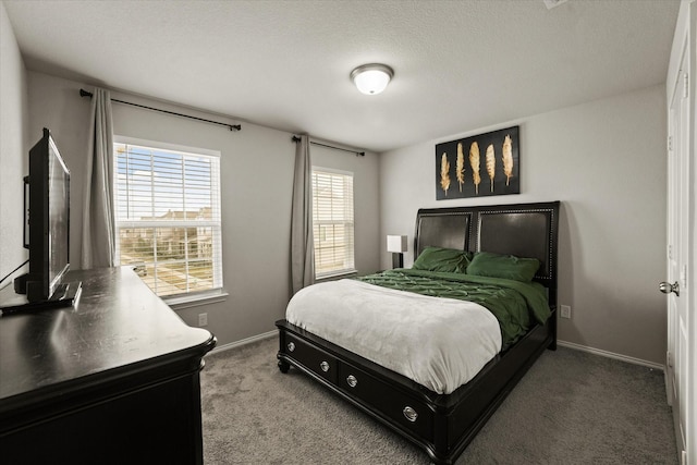 carpeted bedroom with a textured ceiling