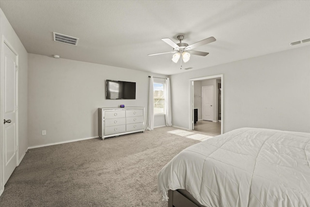 bedroom with ceiling fan and light colored carpet