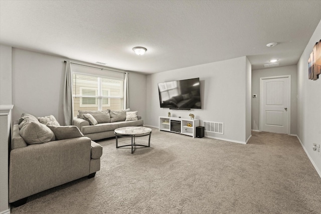 living room with a textured ceiling and carpet flooring