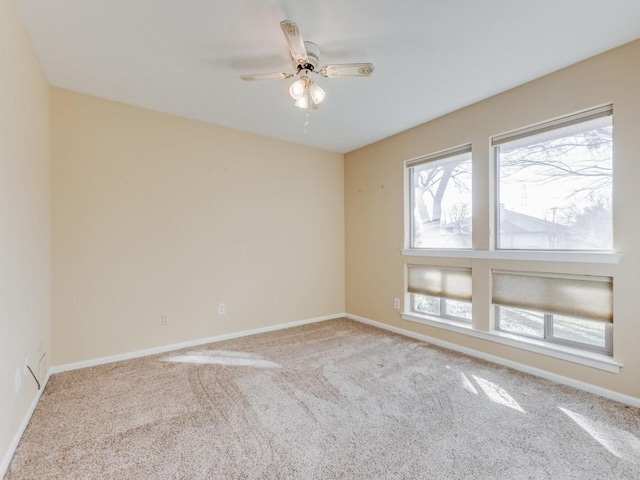 carpeted empty room with ceiling fan