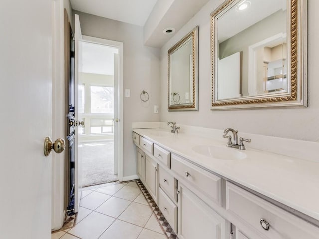 bathroom with tile patterned flooring and vanity