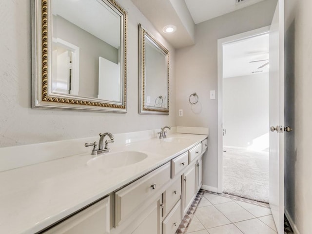 bathroom with ceiling fan, tile patterned floors, and vanity