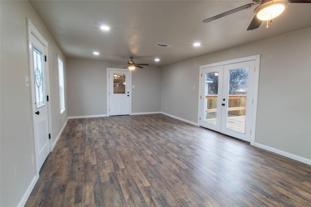 spare room with ceiling fan, french doors, dark hardwood / wood-style flooring, and plenty of natural light