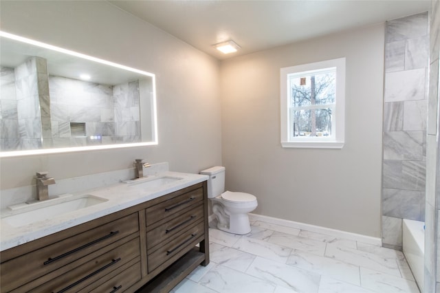 bathroom featuring toilet and vanity