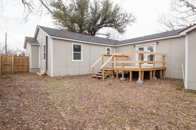 rear view of house featuring a deck