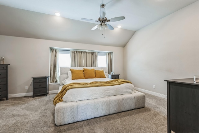 carpeted bedroom with vaulted ceiling and ceiling fan