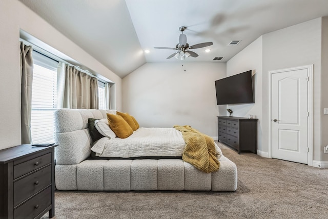 carpeted bedroom with ceiling fan and lofted ceiling