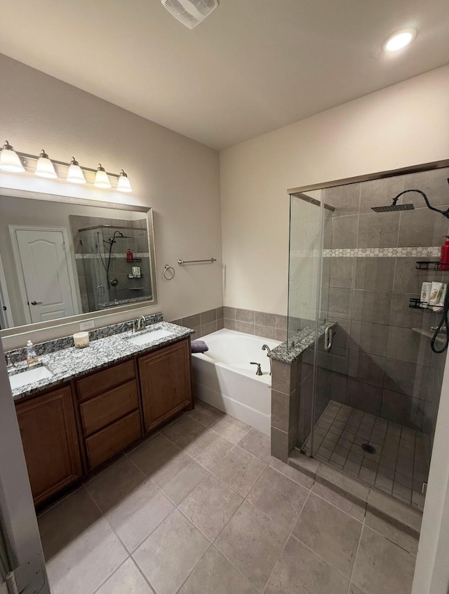 bathroom with vanity, independent shower and bath, and tile patterned flooring