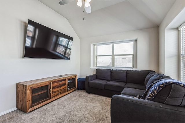 living room with ceiling fan, light carpet, and lofted ceiling