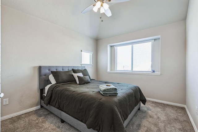 carpeted bedroom featuring vaulted ceiling and ceiling fan