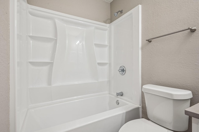 bathroom featuring toilet and bathing tub / shower combination