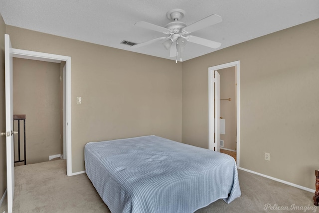 bedroom with ceiling fan and light colored carpet