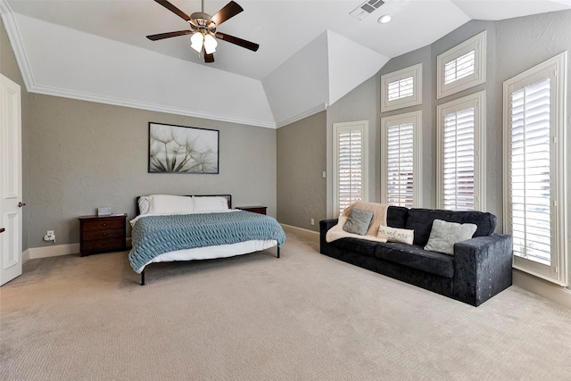 bedroom with vaulted ceiling, light colored carpet, and ceiling fan