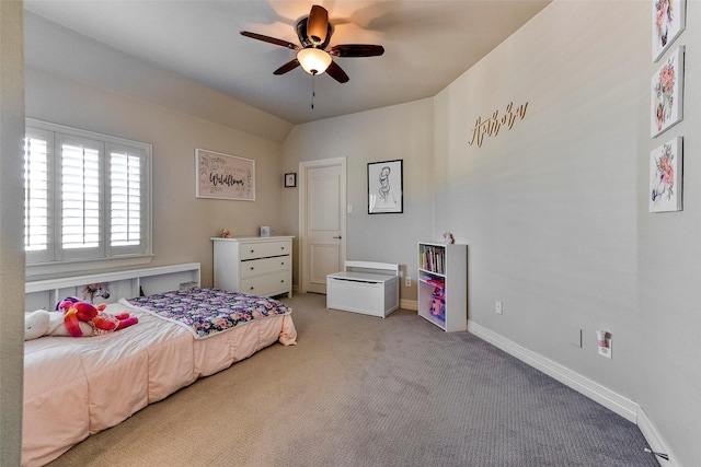 bedroom with ceiling fan, vaulted ceiling, and light carpet