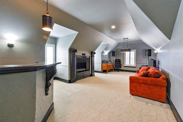 home theater featuring vaulted ceiling and carpet floors