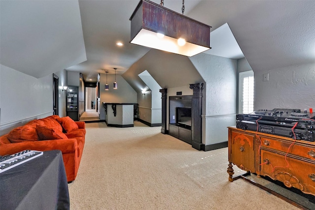 bedroom featuring light colored carpet and vaulted ceiling