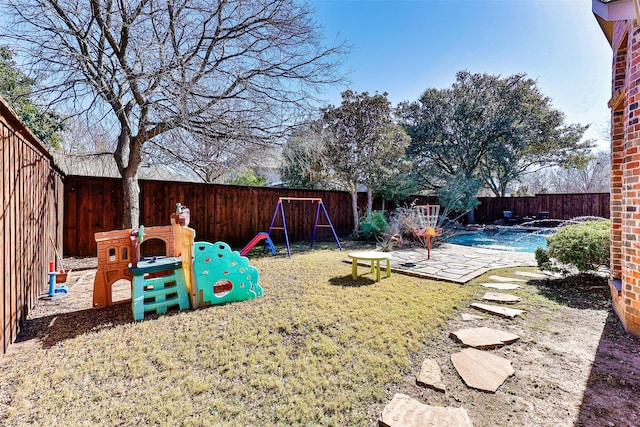 view of yard with a patio and a playground