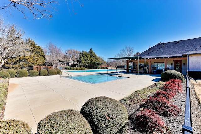 view of swimming pool featuring a patio area