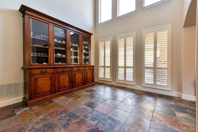 interior space with a high ceiling