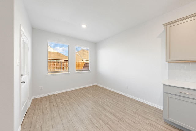 spare room featuring light hardwood / wood-style flooring