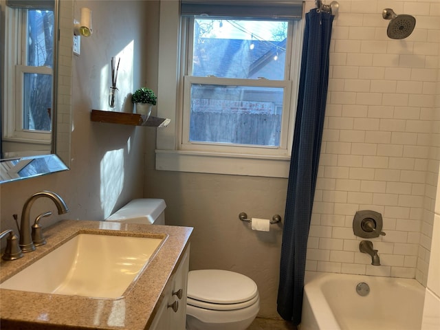 full bathroom with toilet, vanity, and shower / bath combo