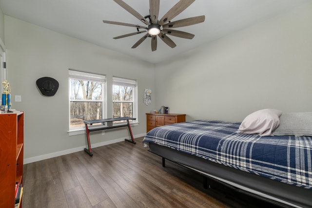 bedroom with ceiling fan and dark hardwood / wood-style floors