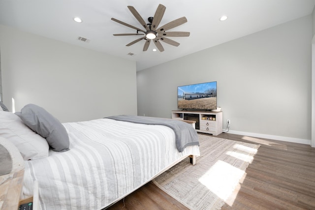 bedroom with ceiling fan and wood-type flooring