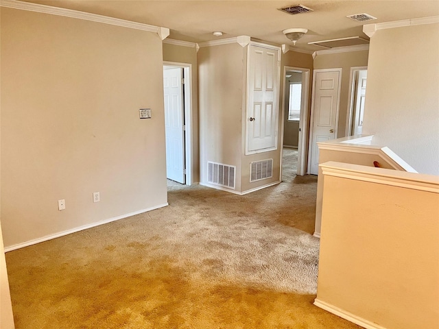 empty room featuring carpet flooring and ornamental molding