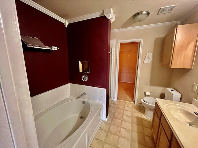 bathroom with toilet, a bath, crown molding, and vanity