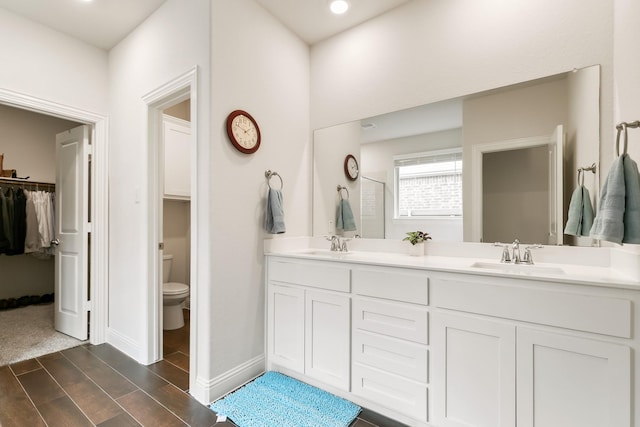 bathroom with toilet and vanity