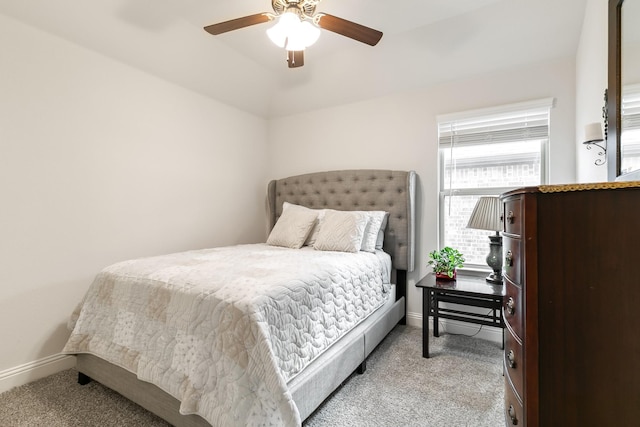 bedroom with light carpet and ceiling fan