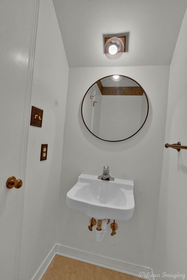 bathroom featuring tile patterned floors and sink