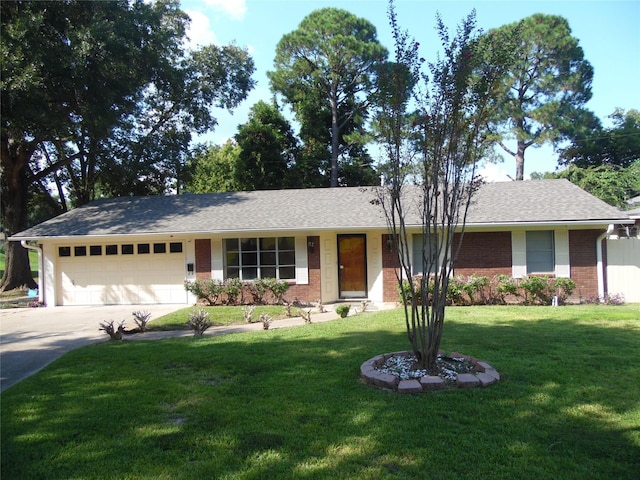 ranch-style house with a garage and a front yard